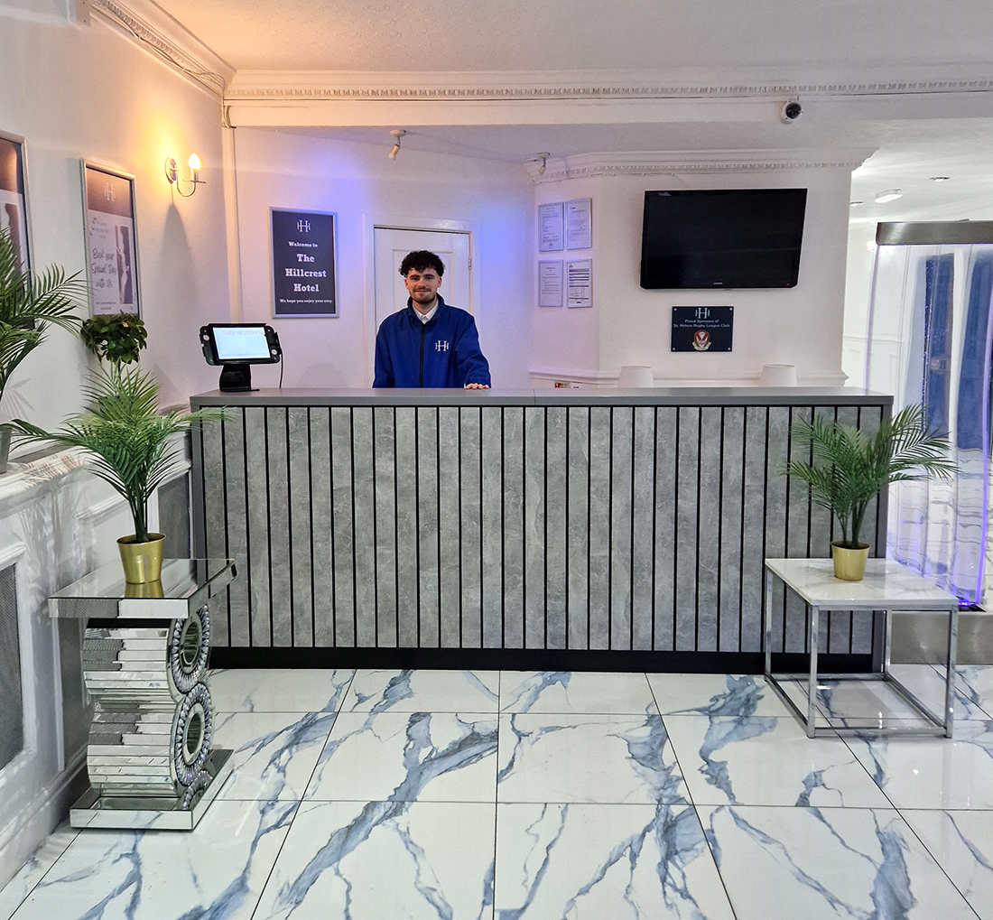 Reception area and receptionist at the Hillcrest Hotel.